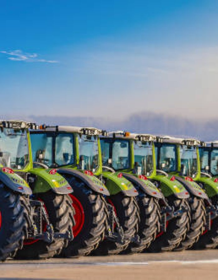 Exhibition / new tractors lined up next to each other in a row